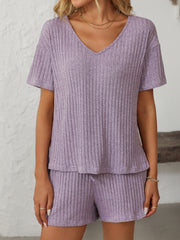 Lilac ribbed V-neck loungewear set with short sleeves and drawstring shorts.