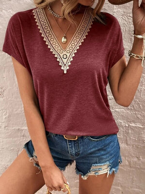 Burgundy dolman sleeve top with lace V-neck detail