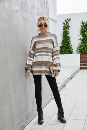 Multicolor horizontal stripe knit sweater with balloon sleeves and crew neck.