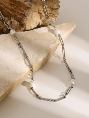 Silver two-tone pearl link necklace with paperclip chain and pearl accents.