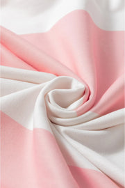 Striped sweatshirt in blush pink and white with a soft knit texture.