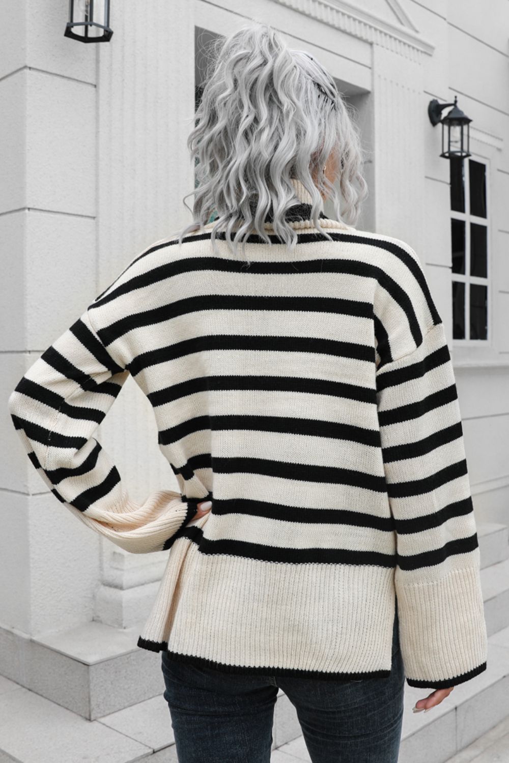 Beige acrylic striped turtleneck sweater with wide bell sleeves.