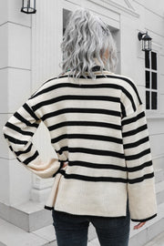 Beige acrylic striped turtleneck sweater with wide bell sleeves.