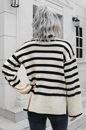 Beige acrylic striped turtleneck sweater with wide bell sleeves.