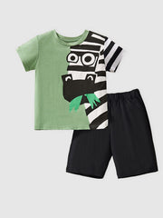 Green cotton tee with playful zebra graphic and black shorts.