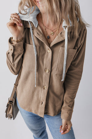 Mocha corduroy shirt jacket with contrast hood and button front, styled with jeans.