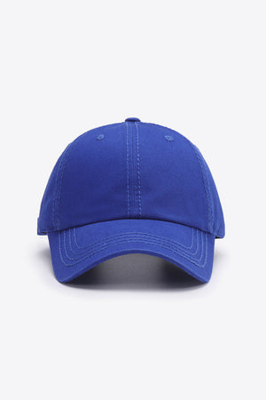 Cobalt canvas baseball cap with stitched details and curved brim.