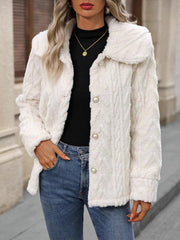 Cream cable knit collar jacket with pearl buttons and textured fabric.