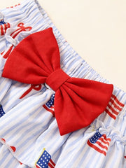 Patriotic baby outfit with red bow and American flag print on blue stripes.