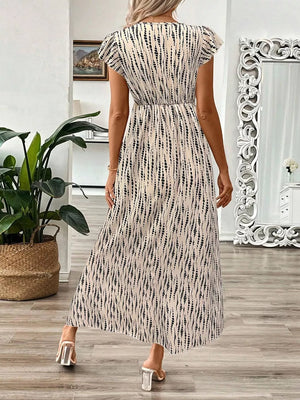 Floral print midi dress in black and apricot with cap sleeves and a-line cut.
