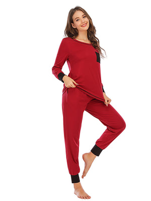 Wine loungewear set with black trim, long sleeves, crew neck, and black pocket detail.
