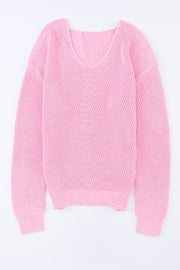 Relaxed knit v-neck pullover sweater in blush pink acrylic with chevron stitch detail.