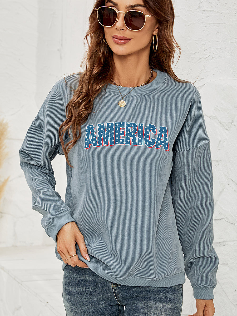 French Blue corduroy sweatshirt with "AMERICA" graphic, crewneck, long sleeves.
