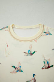Beige pajama top with crew neck and mallard duck print.