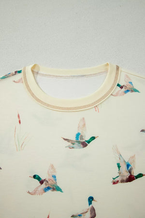 Beige pajama top with crew neck and mallard duck print.