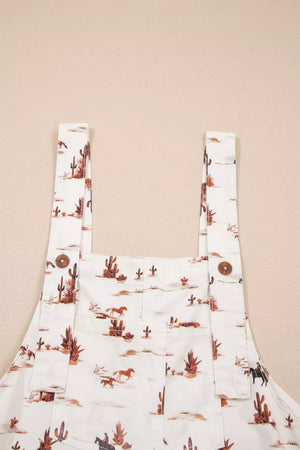Desert motif adjustable jumpsuit in white with cactus and horse print, cotton fabric.