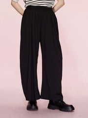 Black pleated drape palazzo trousers with a wide leg and elastic waistband.