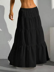 Black tiered maxi skirt with elastic waistband and textured fabric