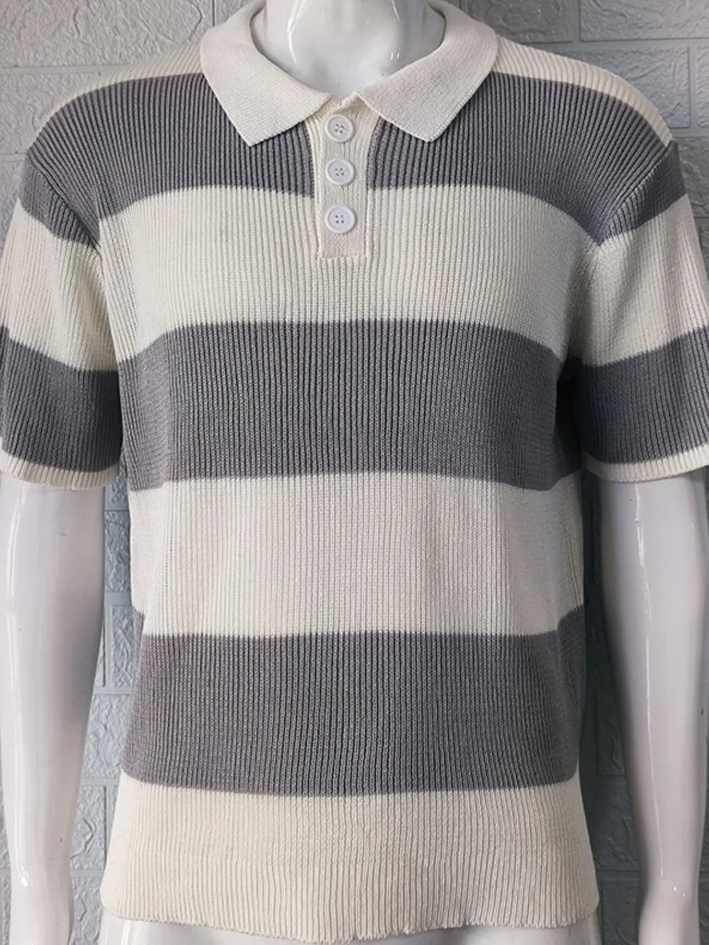 Short sleeve ribbed knit polo shirt with horizontal stripes in dark gray and off-white.