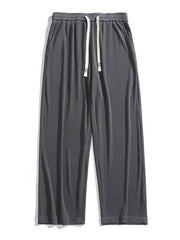 Men's dark gray ribbed drawstring wide leg sweatpants with pockets.