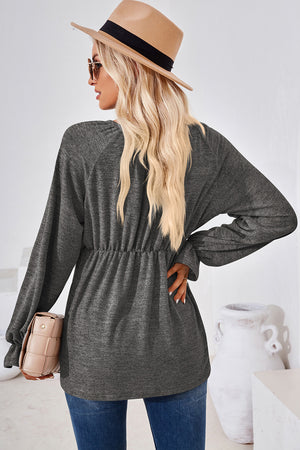 Dark Gray long sleeve blouse with cinched waist and balloon sleeves.