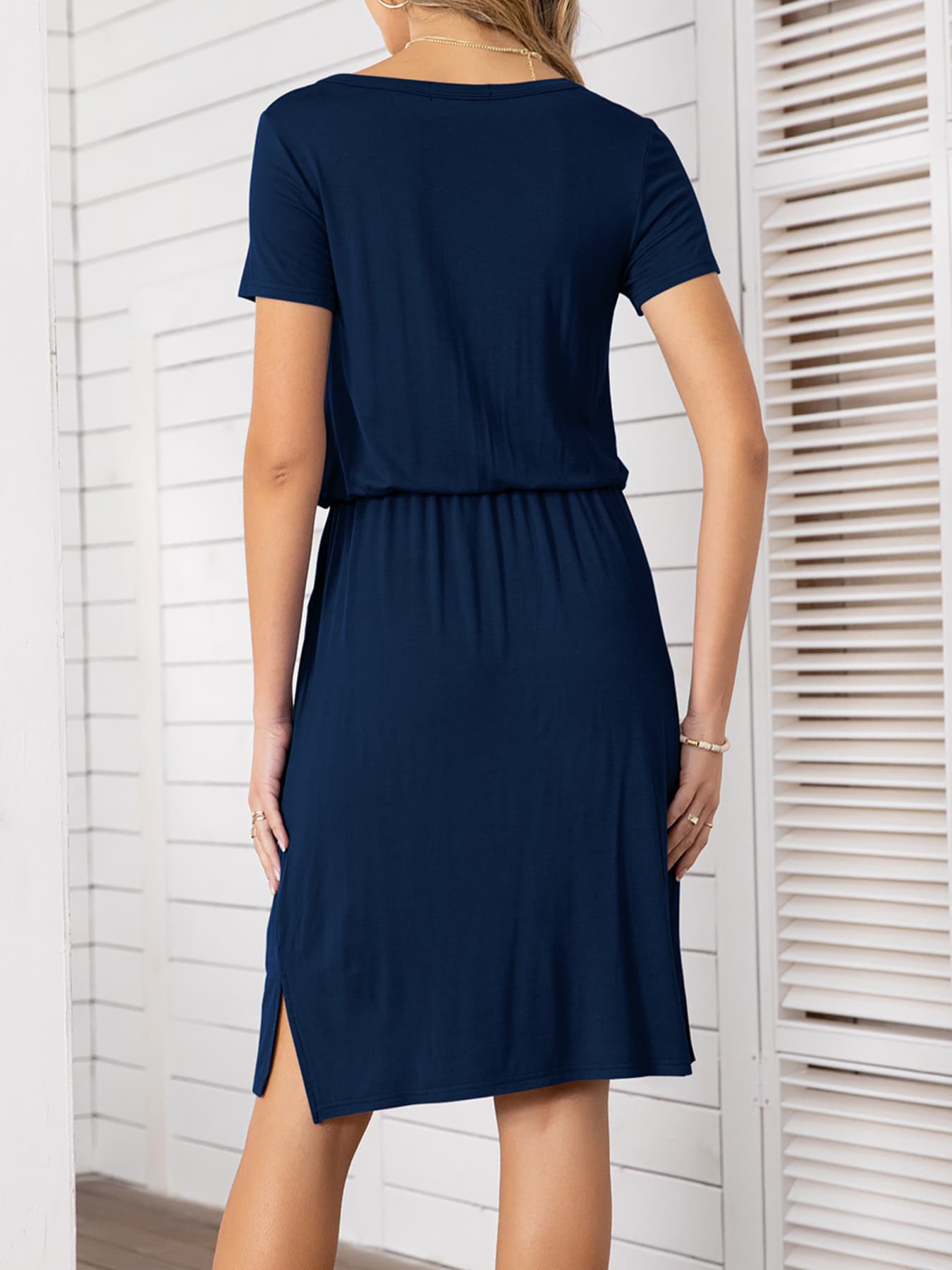 Navy midi dress with drawstring waist, short sleeves, and side slit hem.