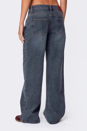 Wide-leg denim jeans in Dusty Blue with a subtle flare and buttoned closure.