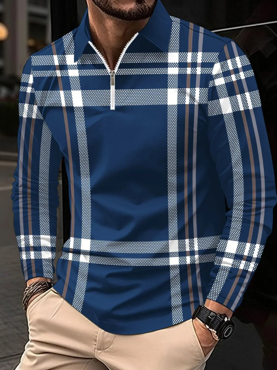Navy plaid zip polo shirt with long sleeves and a collared neckline.