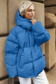 Azure oversized puffer jacket with hood and large pockets.