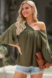 Textured gauze blouse in army green with gathered sleeves and off-the-shoulder neckline.