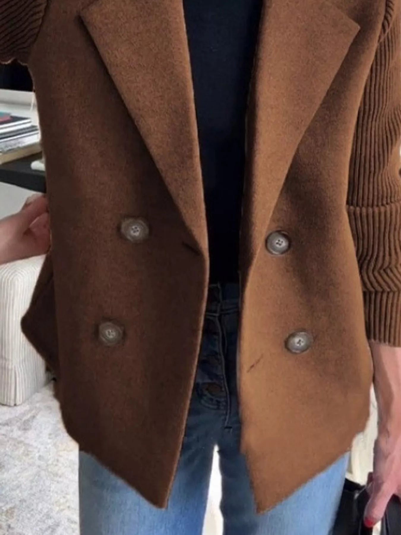 Brown double-breasted wool blend blazer with button detail and ribbed sleeves.