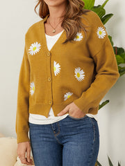 Mustard V-neck cardigan with embroidered daisies and button front.