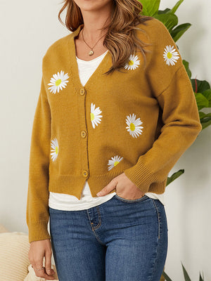 Mustard V-neck cardigan with embroidered daisies and button front.