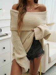 Beige ribbed knit off-the-shoulder sweater with wide sleeves and a cocoon silhouette.