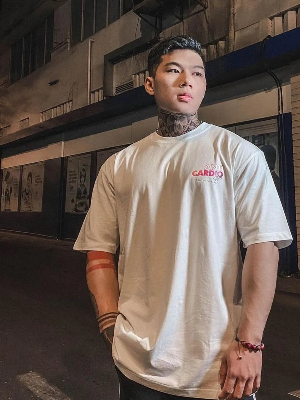 White graphic tee with "Anti Cardio Club" text and graphic detail on chest.