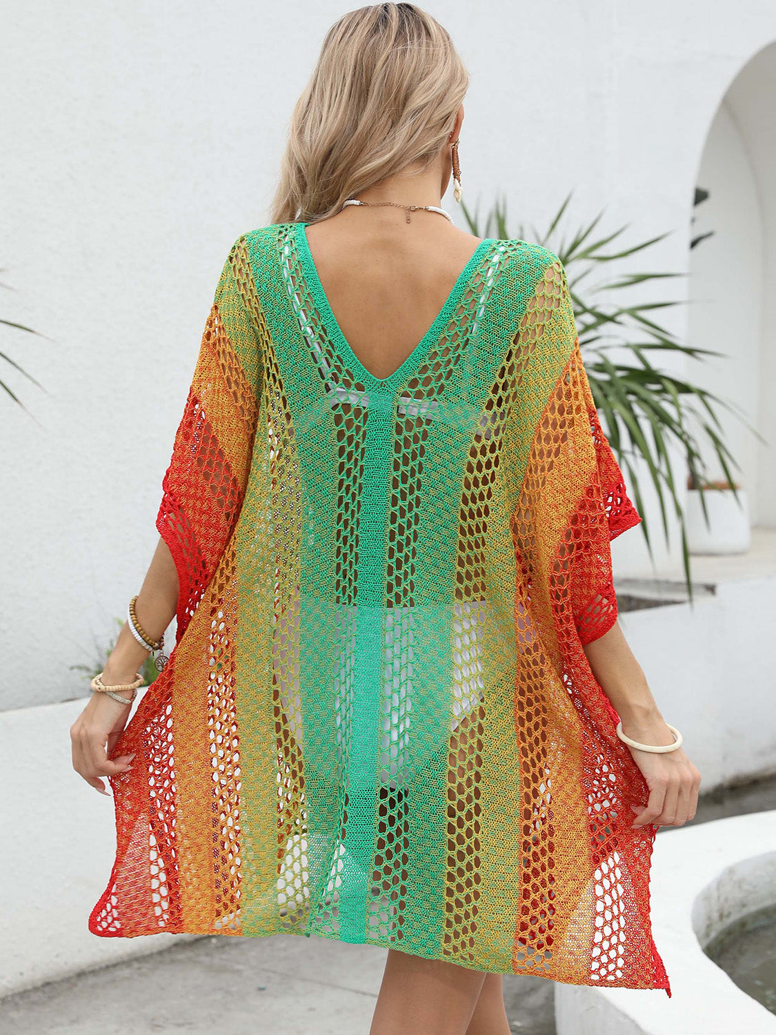 Ombre crochet kaftan cover-up with V-neck and short sleeves in red, orange, yellow, and green.