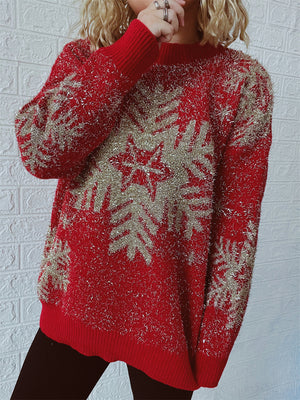 Red acrylic knit sweater with glitter snowflake pattern and crew neck.