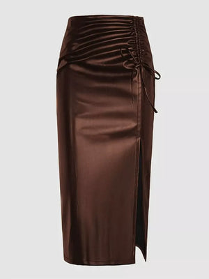 Brown faux-leather midi skirt with ruched detail, drawstring, and side slit.