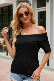 Black ribbed knit off-the-shoulder asymmetric top with short sleeves.