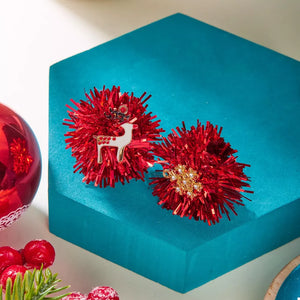 Red tinsel ball earrings with reindeer and snowflake charms, 18k gold accents.