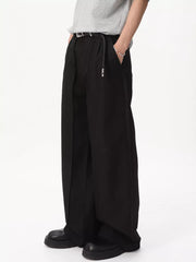 Black relaxed wide-leg pleated trousers with a basic style and a belt.