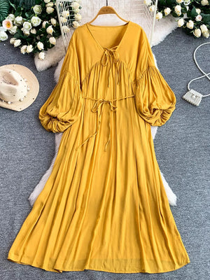 Yellow bohemian maxi dress with balloon sleeves and tie neckline