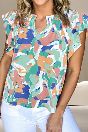 Abstract print blouse with ruffle sleeves, smocked neckline, and keyhole detail in Gum Leaf and Aqua colors.