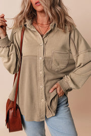Tan waffle knit overshirt with patch pocket and button front, styled with jeans.