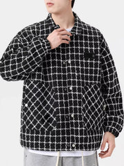 Oversized black and white plaid button-up jacket with chest pocket detail
