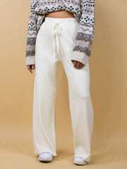 White ribbed knit palazzo trousers with drawstring waist and wide leg