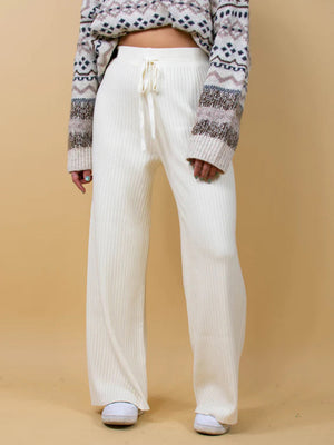 White ribbed knit palazzo trousers with drawstring waist and wide leg