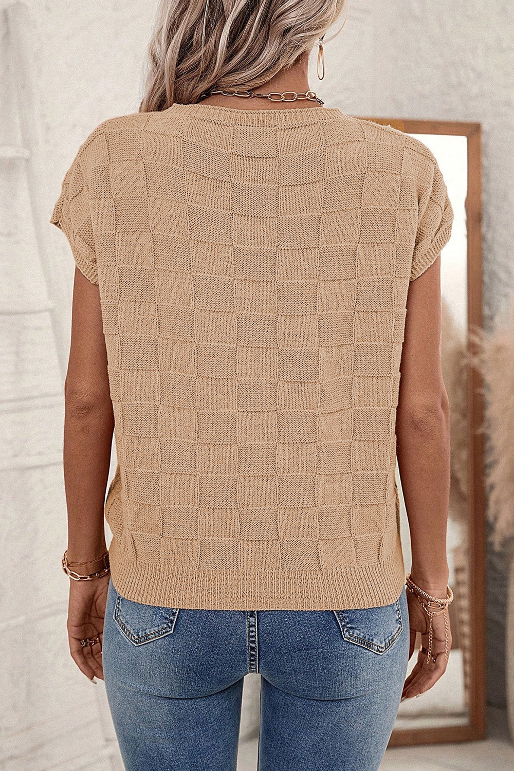 Tan checkered knit tee with short sleeves and a crew neck.