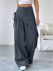 Chic dark gray maternity trousers with high waist, wide leg, and wrap detail.