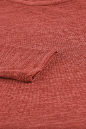 Deep Red heathered knit long sleeve top with cuffed sleeve detail.
